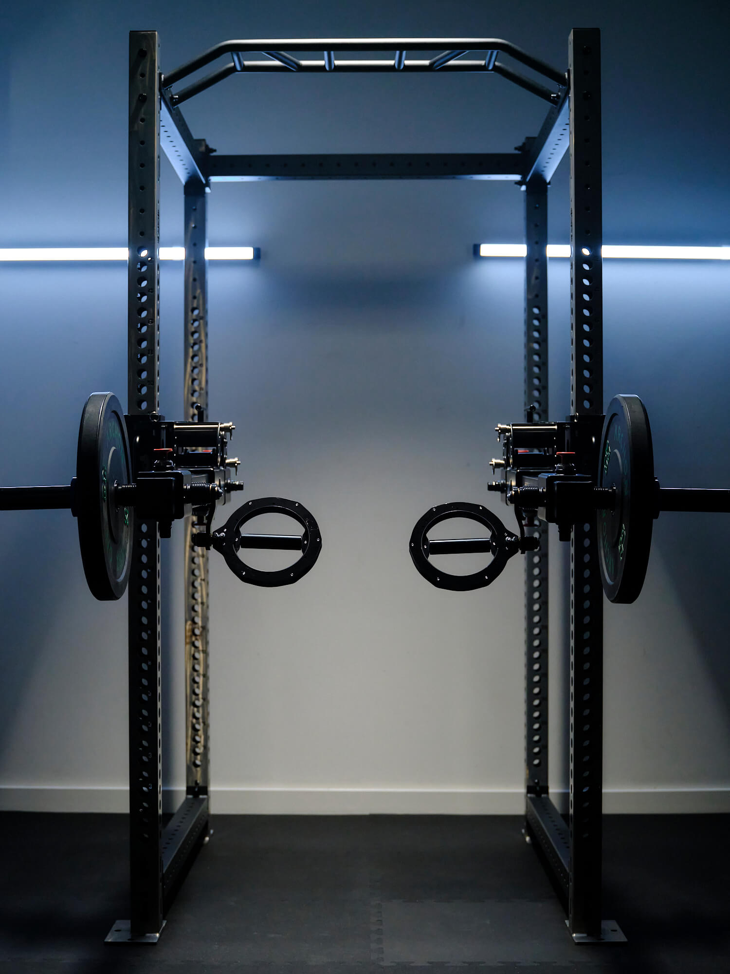Heavy-duty weightlifting rack with RVL Strength Wings attached