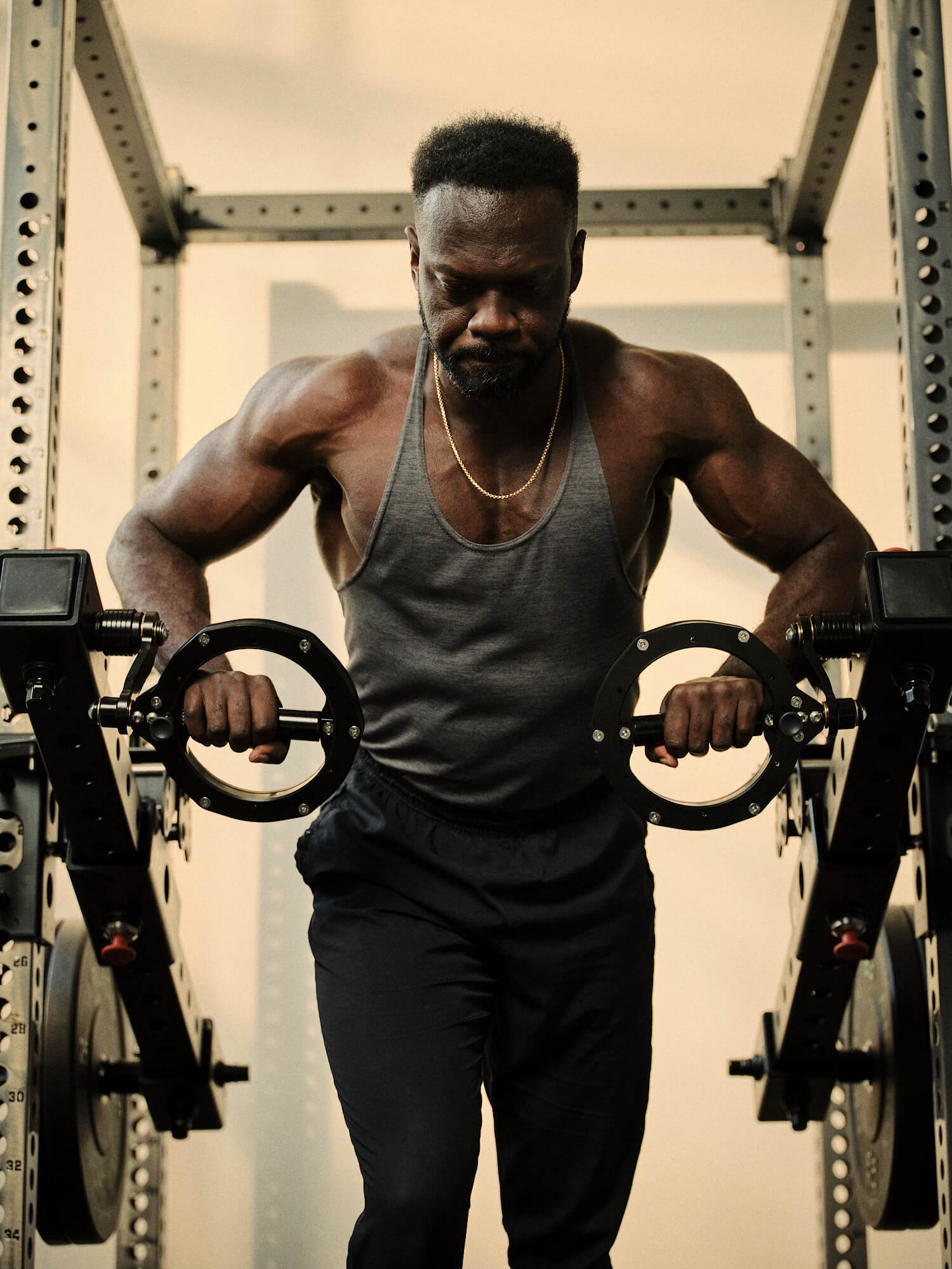 Man doing tricep presses on RVL Wings 