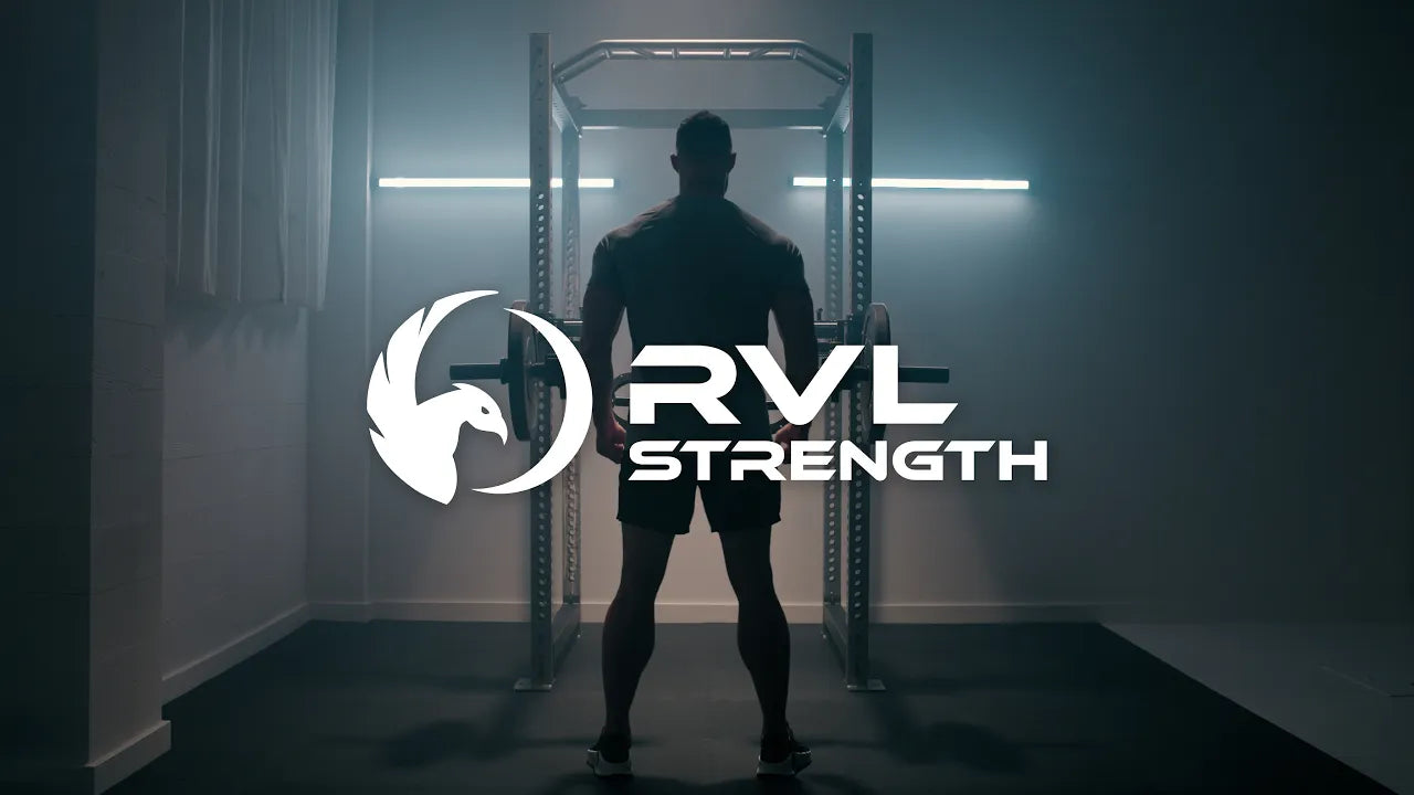 Load video: <p>Experience An Elite Gym Workout – Outside The Gym. RVL Strength reimagines the home gym experience to provide ergonomic comfort, greater flexibility, and more exercises than ever before available in a rack attachment. Lift Your Max– Without a Spotter</p>